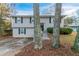 Gray two-story house with gray trim and landscaping at 2098 Mallard Crst, Lithonia, GA 30058