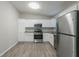 Kitchen with white cabinets, granite counters, and stainless steel appliances at 2098 Mallard Crst, Lithonia, GA 30058