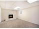 Finished basement with a cozy fireplace and carpet at 2751 Lloyd Rd, Decatur, GA 30034