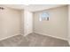 Unfinished basement area with neutral walls and carpet at 2751 Lloyd Rd, Decatur, GA 30034