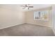 Spacious bedroom with neutral carpeting and large window at 2751 Lloyd Rd, Decatur, GA 30034