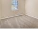 Well-lit bedroom with neutral walls and carpet at 2751 Lloyd Rd, Decatur, GA 30034