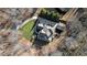 Aerial view of house, showing the home's size, landscaping, and driveway at 221 Oakwood Dr, Cumming, GA 30040