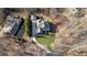 Aerial view of a home showcasing a large yard, driveway, and surrounding trees at 221 Oakwood Dr, Cumming, GA 30040