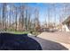 Multi-level deck with a view of the wooded backyard at 221 Oakwood Dr, Cumming, GA 30040