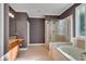 Bathroom boasts a shower, tub, and vanity with granite countertop at 221 Oakwood Dr, Cumming, GA 30040