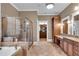 Spacious bathroom with double vanity, soaking tub, and walk-in shower at 221 Oakwood Dr, Cumming, GA 30040