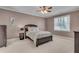 Comfortable bedroom with carpeted floor and a large window at 221 Oakwood Dr, Cumming, GA 30040
