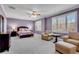 Spacious Primary bedroom with sitting area and plush carpet at 221 Oakwood Dr, Cumming, GA 30040