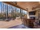 Large deck with comfortable seating and a covered area at 221 Oakwood Dr, Cumming, GA 30040