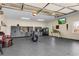 Finished garage with extensive storage and a motorcycle at 221 Oakwood Dr, Cumming, GA 30040