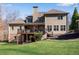 Two-story house with large deck and backyard at 221 Oakwood Dr, Cumming, GA 30040