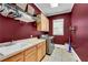 Laundry room with built-in cabinets and a large sink at 221 Oakwood Dr, Cumming, GA 30040