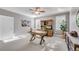 Home office with built-in cabinetry and hardwood desk at 221 Oakwood Dr, Cumming, GA 30040