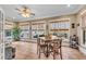 Bright sunroom with multiple windows and seating area at 221 Oakwood Dr, Cumming, GA 30040