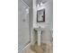 Bathroom with pedestal sink, toilet and a glass shower at 225 Carlyle Park Ne Dr, Atlanta, GA 30307