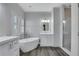 Elegant bathroom with free-standing tub, walk-in shower, and modern vanity at 225 Carlyle Park Ne Dr, Atlanta, GA 30307