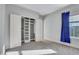 Well-lit bedroom with a large closet and a window with curtains at 225 Carlyle Park Ne Dr, Atlanta, GA 30307