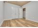 Bright bedroom featuring double doors and wood-look floors at 225 Carlyle Park Ne Dr, Atlanta, GA 30307