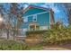 Green house with a stone retaining wall at 225 Carlyle Park Ne Dr, Atlanta, GA 30307