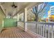 Spacious front porch with wooden floors and white railings at 225 Carlyle Park Ne Dr, Atlanta, GA 30307
