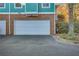 White garage door with brick facade at 225 Carlyle Park Ne Dr, Atlanta, GA 30307