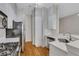 Modern kitchen with white cabinets, quartz countertops, and stainless steel appliances at 225 Carlyle Park Ne Dr, Atlanta, GA 30307