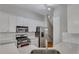 Updated kitchen, featuring white cabinets and hexagon backsplash at 225 Carlyle Park Ne Dr, Atlanta, GA 30307