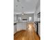 Open concept kitchen and living room with hardwood floors and island at 225 Carlyle Park Ne Dr, Atlanta, GA 30307