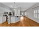 Open concept kitchen and living area with hardwood floors and island at 225 Carlyle Park Ne Dr, Atlanta, GA 30307
