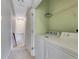 Convenient laundry room with washer, dryer, and extra shelving at 225 Carlyle Park Ne Dr, Atlanta, GA 30307