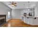 Bright living room with hardwood floors, fireplace, and updated kitchen at 225 Carlyle Park Ne Dr, Atlanta, GA 30307
