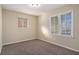 Well-lit bedroom with carpet flooring and large windows at 2970 Eleanor Nw Ter, Atlanta, GA 30318