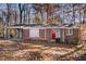 Brick ranch house with carport and red front door at 2970 Eleanor Nw Ter, Atlanta, GA 30318