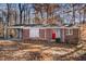 Brick ranch house with carport and red front door at 2970 Eleanor Nw Ter, Atlanta, GA 30318