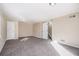 Large carpeted living room with doors to other rooms at 2970 Eleanor Nw Ter, Atlanta, GA 30318