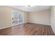 Living room with wood-look floors and large window at 2970 Eleanor Nw Ter, Atlanta, GA 30318