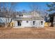 Back of the house with a small yard and deck at 4187 Mistymorn Way, Powder Springs, GA 30127