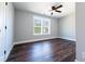 Bright bedroom features wood floors, large windows, and a ceiling fan at 4187 Mistymorn Way, Powder Springs, GA 30127