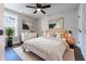 Modern bedroom showcasing wood floors, a ceiling fan, and neutral decor at 4187 Mistymorn Way, Powder Springs, GA 30127