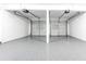 Two car garage featuring epoxy flooring at 4187 Mistymorn Way, Powder Springs, GA 30127