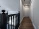 Well-lit upstairs hallway with hardwood floors, modern colors and closet space at 4187 Mistymorn Way, Powder Springs, GA 30127