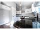 Modern kitchen featuring granite countertops, stainless steel appliances, and white cabinetry at 4187 Mistymorn Way, Powder Springs, GA 30127
