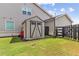 Tan shed with black trim in backyard at 445 Carmichael Cir, Canton, GA 30115