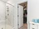 Spa-like bathroom featuring a large walk-in shower and spacious closet at 445 Carmichael Cir, Canton, GA 30115
