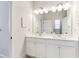 Clean bathroom with double vanity and white cabinets at 445 Carmichael Cir, Canton, GA 30115