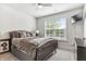 Bedroom with double bed, large window, and a flat-screen TV at 445 Carmichael Cir, Canton, GA 30115
