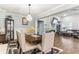 Open concept dining room with a view into the living room at 445 Carmichael Cir, Canton, GA 30115