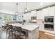 Modern kitchen with white cabinets, large island, and stainless steel appliances at 445 Carmichael Cir, Canton, GA 30115