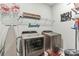 Convenient laundry room with washer, dryer, and ample storage at 445 Carmichael Cir, Canton, GA 30115
